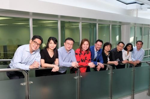Management team group photo in office building